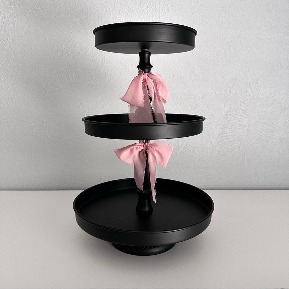Black Three-Tiered Stand with Pink Silk Bow Accents